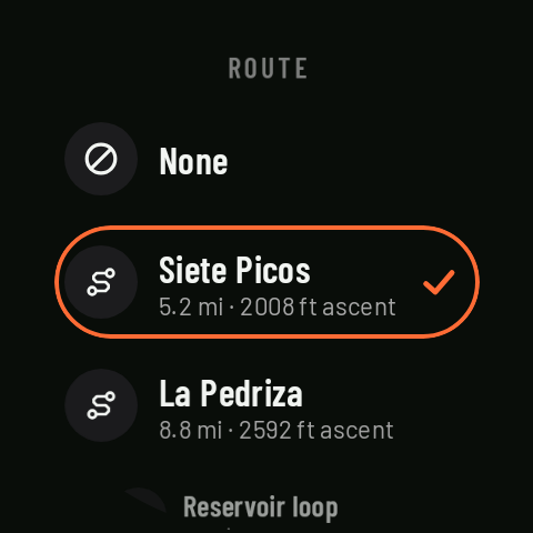 The route list on the watch: three routes with their distance and ascent, one selected