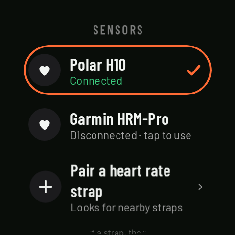 The watch's sensors: two paired heart rate straps, one in use