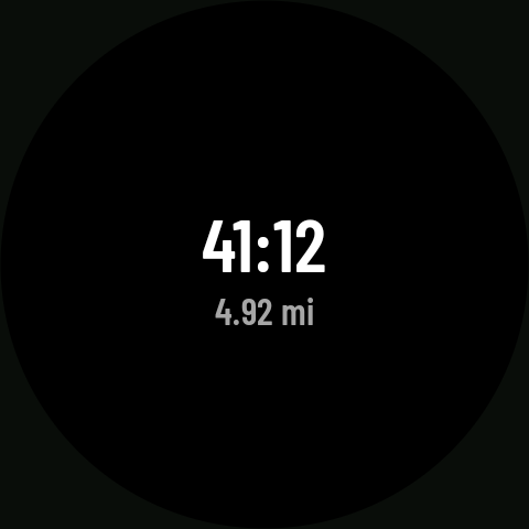 Always-on screen set to Time and distance, with the wrist down: time and distance in white on black
